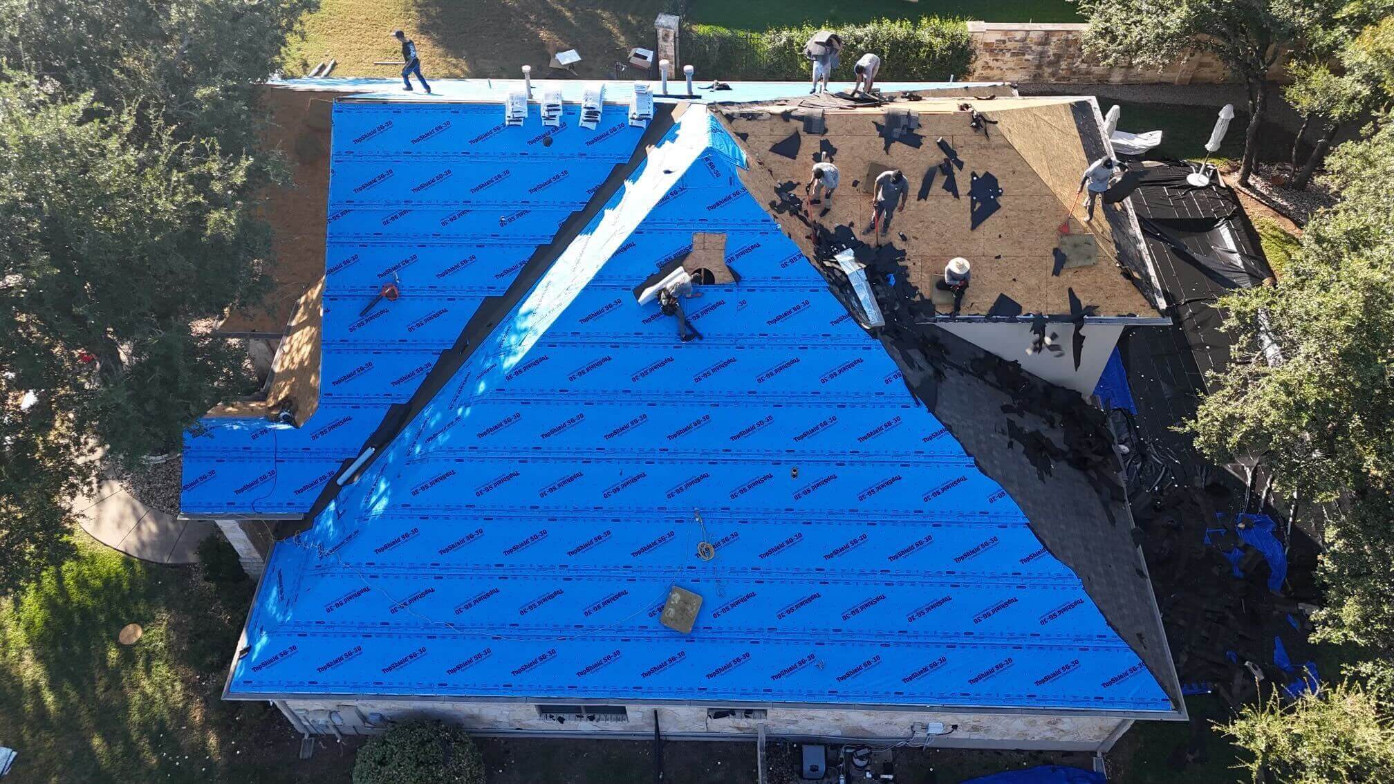 Roofing crew working on a roof